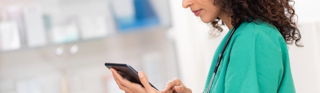 veterinary professional looking at mobile device
