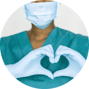 A doctor in scrubs and gloves, making a heart shape with their hands.