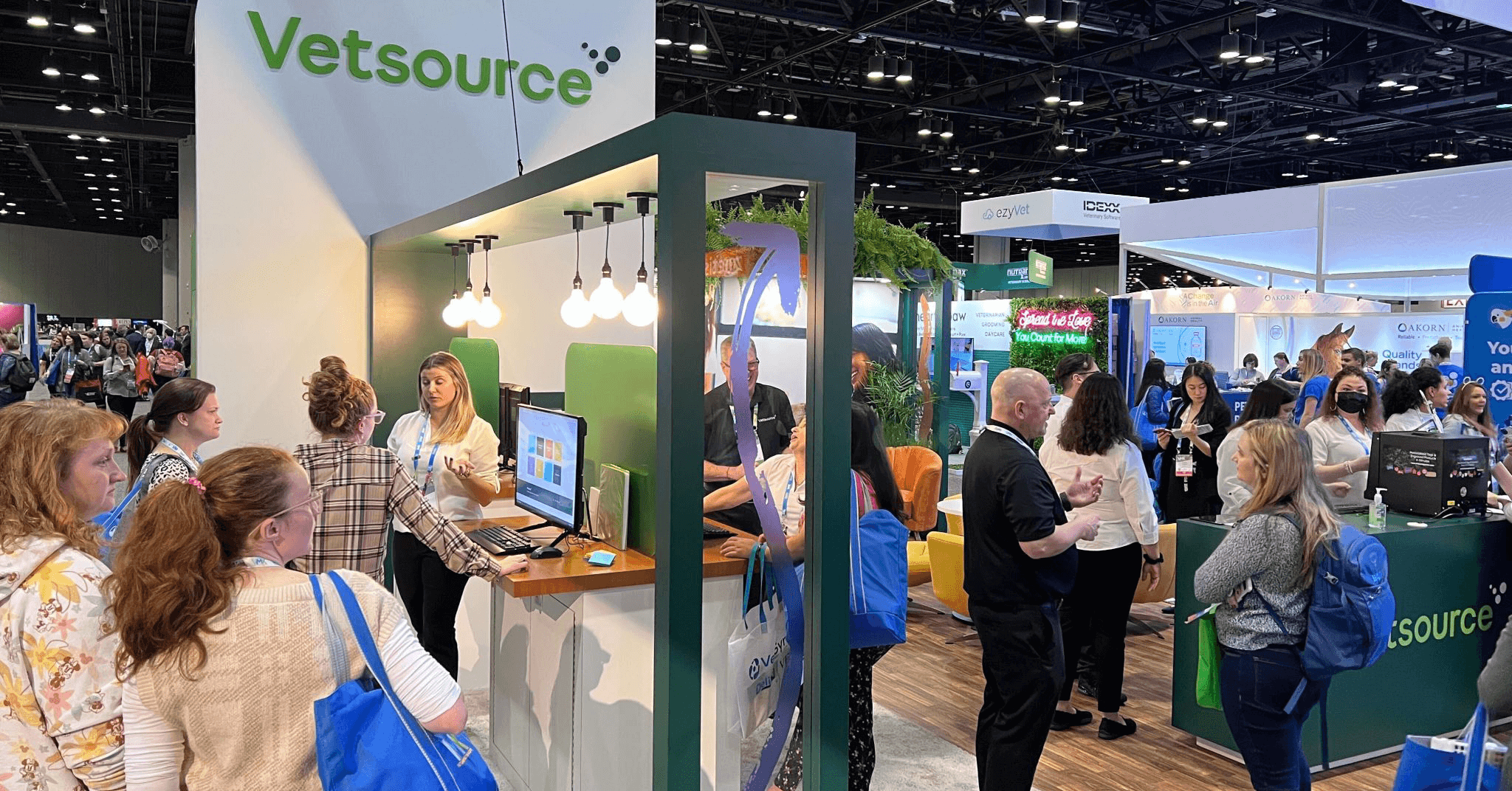 Vetsource booth filled with people at VMX